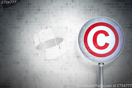 Image of Law concept:  Copyright with optical glass on digital background