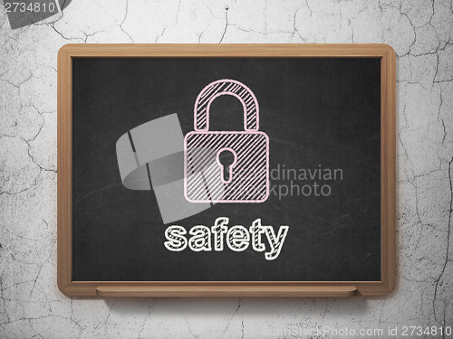 Image of Privacy concept: Closed Padlock and Safety on chalkboard