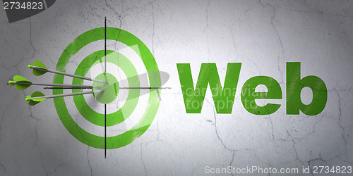 Image of Web development concept: target and Web on wall background
