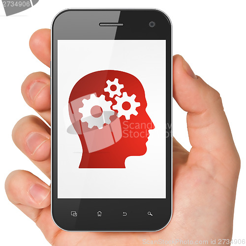 Image of Marketing concept: Head With Gears on smartphone