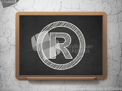 Image of Law concept: Registered on chalkboard background