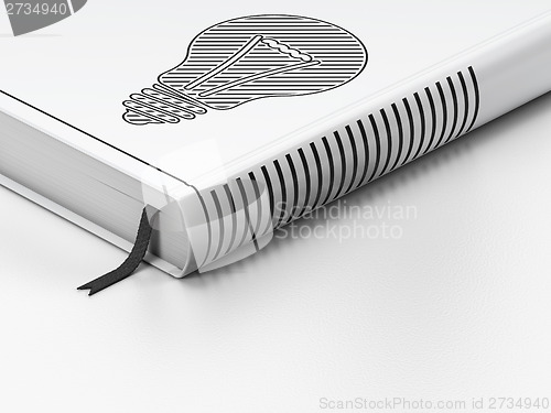 Image of Business concept: closed book, Light Bulb on white background