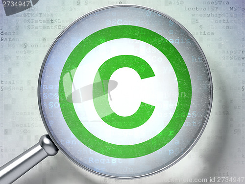 Image of Law concept:  Copyright with optical glass on digital background