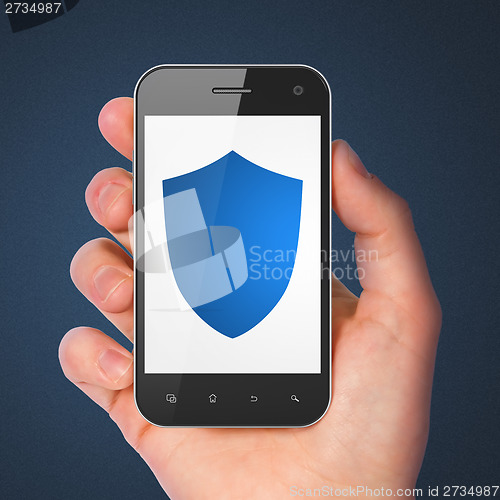 Image of Protection concept: Shield on smartphone