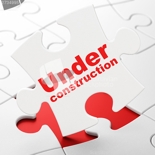 Image of Web development concept: Under Construction on puzzle background