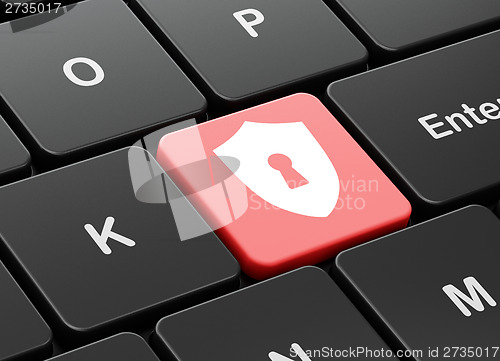 Image of Protection concept: Shield With Keyhole on keyboard background