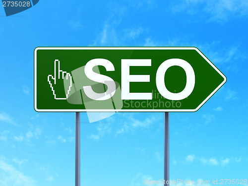 Image of Web design concept: SEO and Mouse Cursor on road sign background