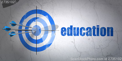 Image of Target and Education on wall background