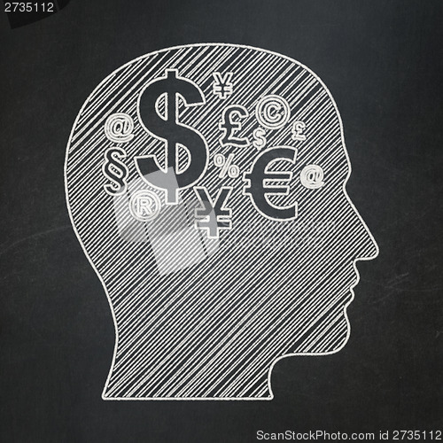 Image of Finance concept: Head With Finance Symbol on chalkboard