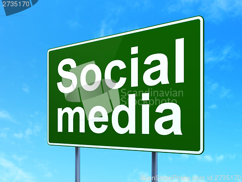 Image of Social network concept: Social Media on road sign background