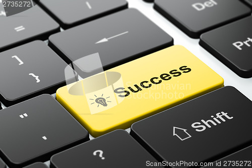 Image of Business concept: Light Bulb and Success on keyboard background