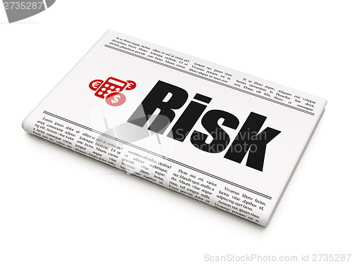 Image of Finance concept: newspaper with Risk and Calculator