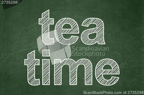 Image of Time concept: Tea Time on chalkboard background