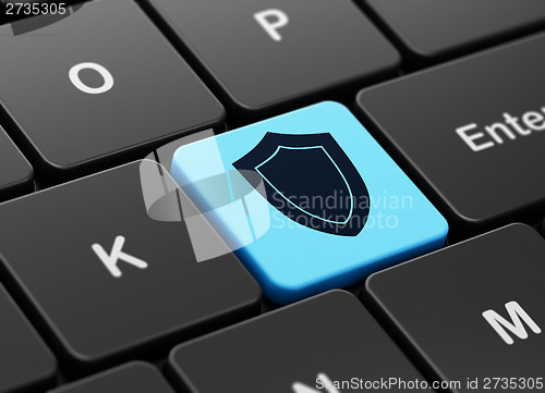 Image of Safety concept: Shield on computer keyboard background