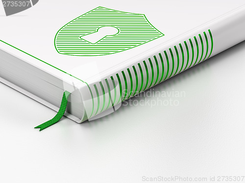 Image of Privacy concept: closed book, Shield With Keyhole on white