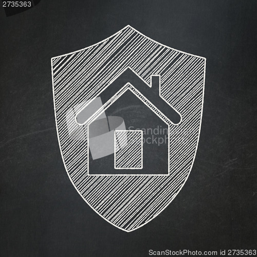 Image of Finance concept: Shield on chalkboard background