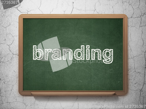 Image of Marketing concept: Branding on chalkboard background