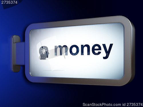 Image of Finance concept: Money and Head With Light Bulb on billboard