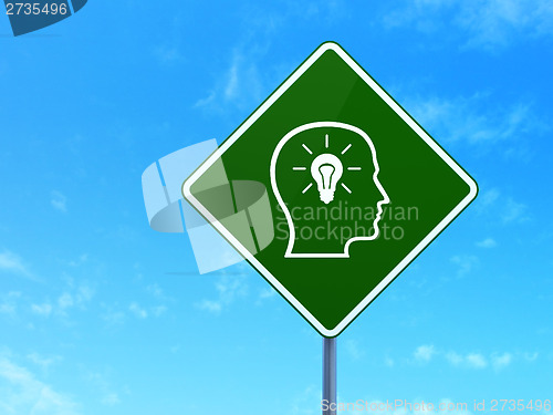 Image of Finance concept: Head With Lightbulb on road sign background