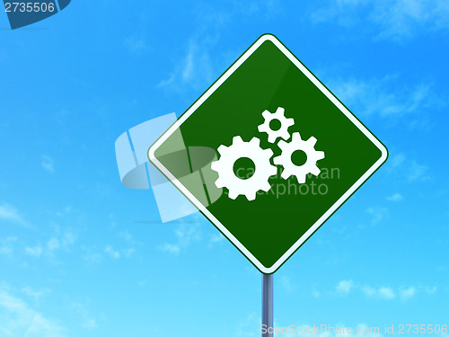 Image of Marketing concept: Gears on road sign background