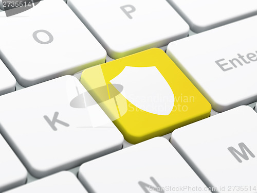 Image of Privacy concept: Shield on computer keyboard background