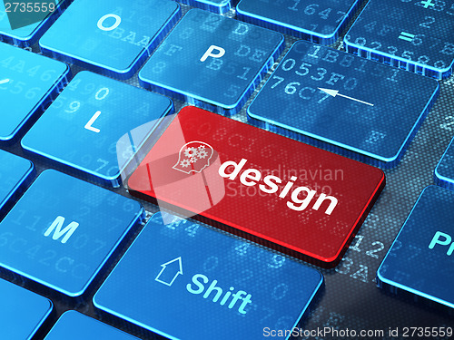 Image of Marketing concept: Head With Gears and Design on keyboard