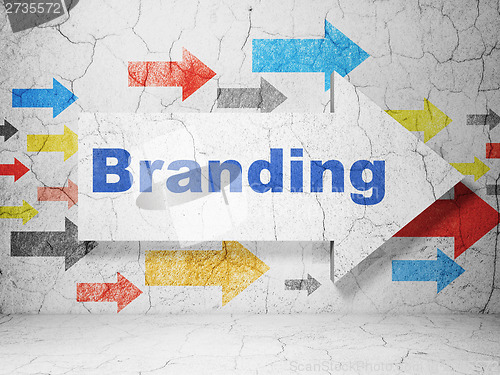 Image of Marketing concept: arrow with Branding on grunge wall background