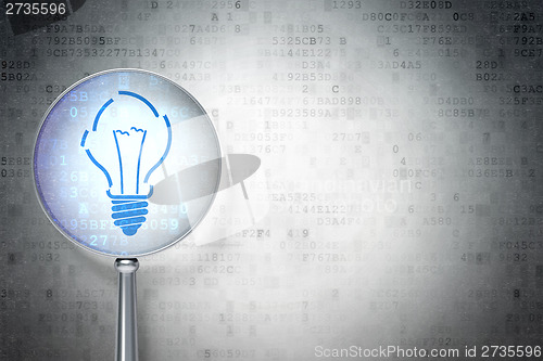 Image of Finance concept:  Light Bulb with optical glass on background