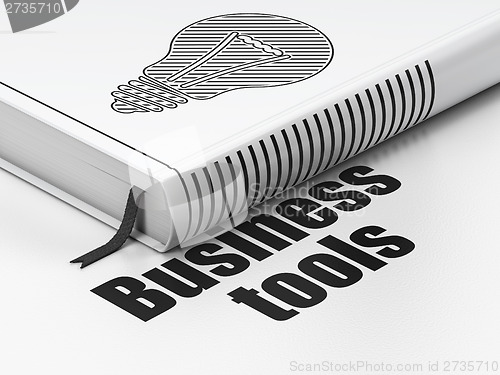 Image of Business concept: book Light Bulb, Business Tools on white