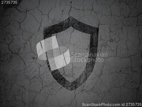 Image of Safety concept: Contoured Shield on grunge wall background