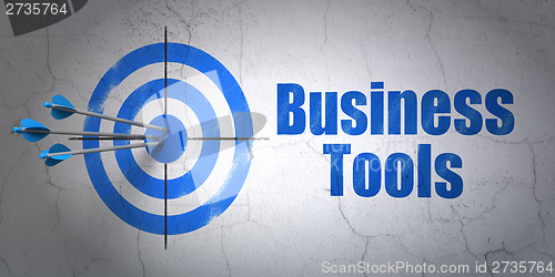 Image of Finance concept: target and Business Tools on wall background