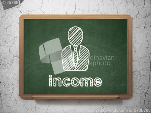 Image of Finance concept: Business Man and Income on chalkboard