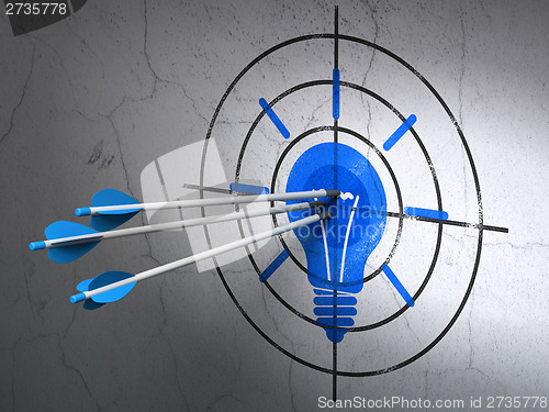 Image of Business concept: arrows in Light Bulb target on wall background