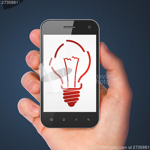 Image of Finance concept: Light Bulb on smartphone