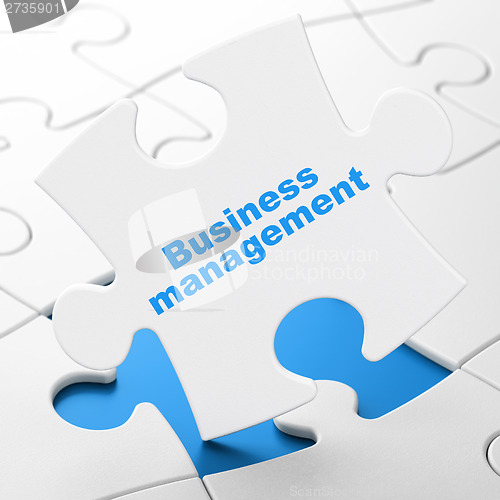 Image of Finance concept: Business Management on puzzle background