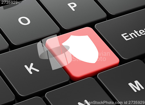 Image of Safety concept: Shield on computer keyboard background