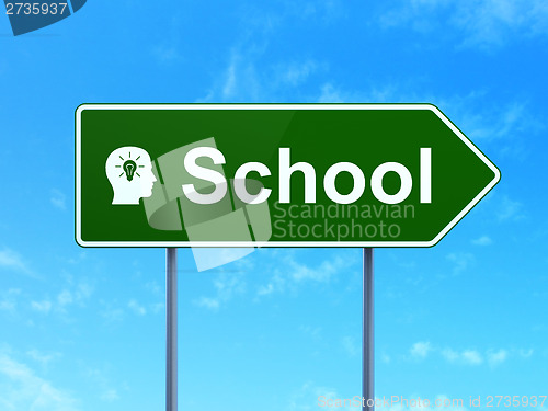 Image of Education concept: School and Head With Light Bulb on sign