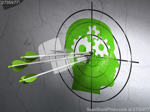 Image of Business concept: arrows in Head With Gears target on wall