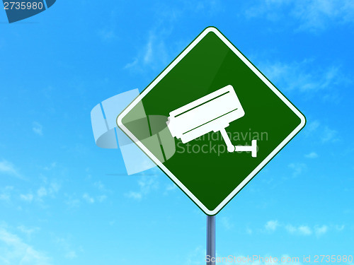 Image of Security concept: Cctv Camera on road sign background