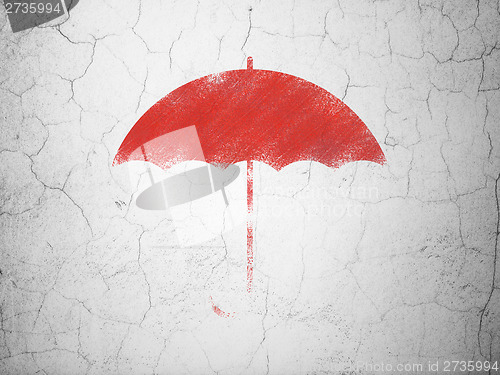 Image of Security concept: Umbrella on wall background