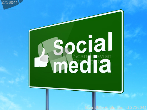 Image of Social network concept: Social Media and Thumb Up on sign