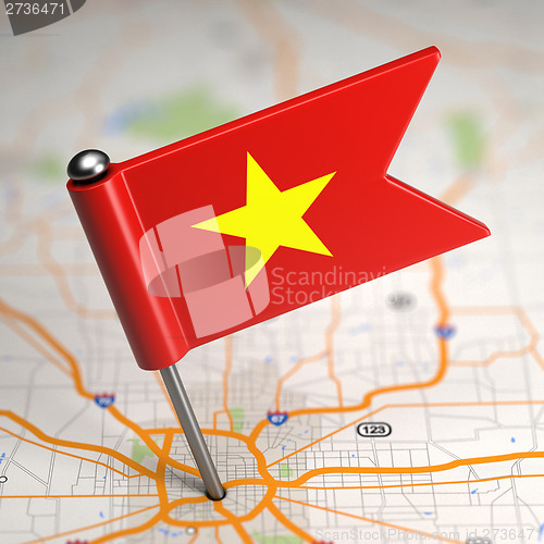 Image of Vietnam Small Flag on a Map Background.