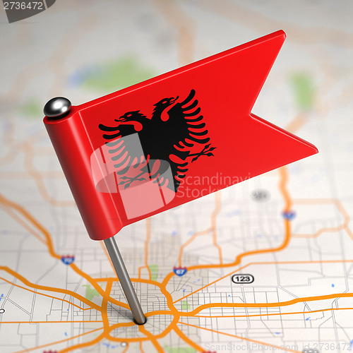 Image of Albania Small Flag on a Map Background.