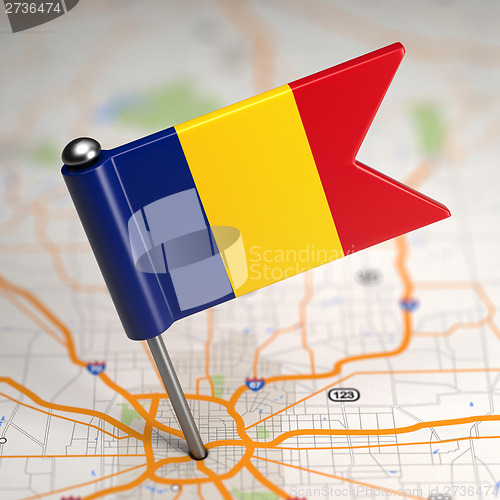 Image of Romania Small Flag on a Map Background.