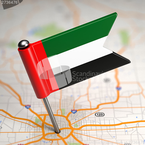 Image of UAE Small Flag on a Map Background.