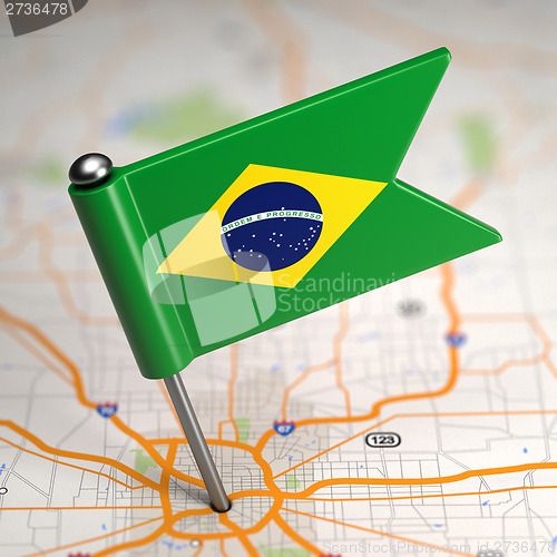 Image of Brazil Small Flag on a Map Background.