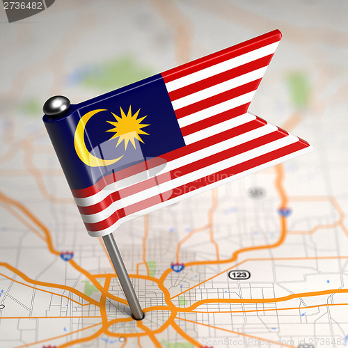 Image of Malaysia Small Flag on a Map Background.