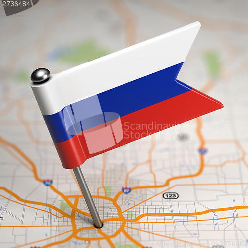 Image of Russia Small Flag on a Map Background.