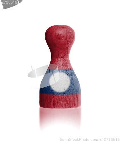 Image of Wooden pawn with a flag painting