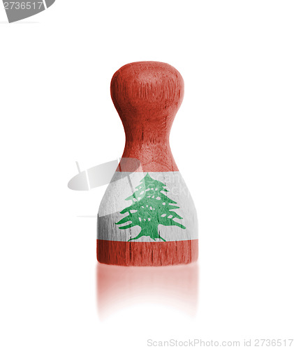 Image of Wooden pawn with a flag painting